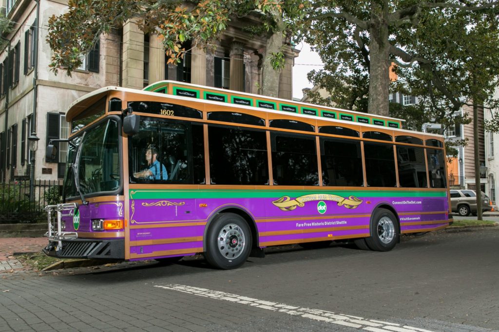 Savannah's Transportation System | Savannah Drean Vacationspurple and green Transportation shuttle bus.